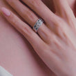 Load and play video in Gallery viewer, Video of Kirk Kara White Gold Dahlia Marquise Shaped Blue Sapphire Diamond Engagement Ring And Band on model
