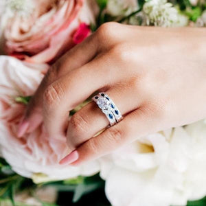 Kirk Kara White Gold Dahlia Marquise Shaped Blue Sapphire Diamond Engagement Ring And Band on model 