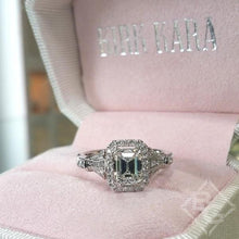 Load image into Gallery viewer, Kirk Kara White Gold &quot;Lori&quot; Emerald Cut Halo Diamond Engagement Ring Front View in Box
